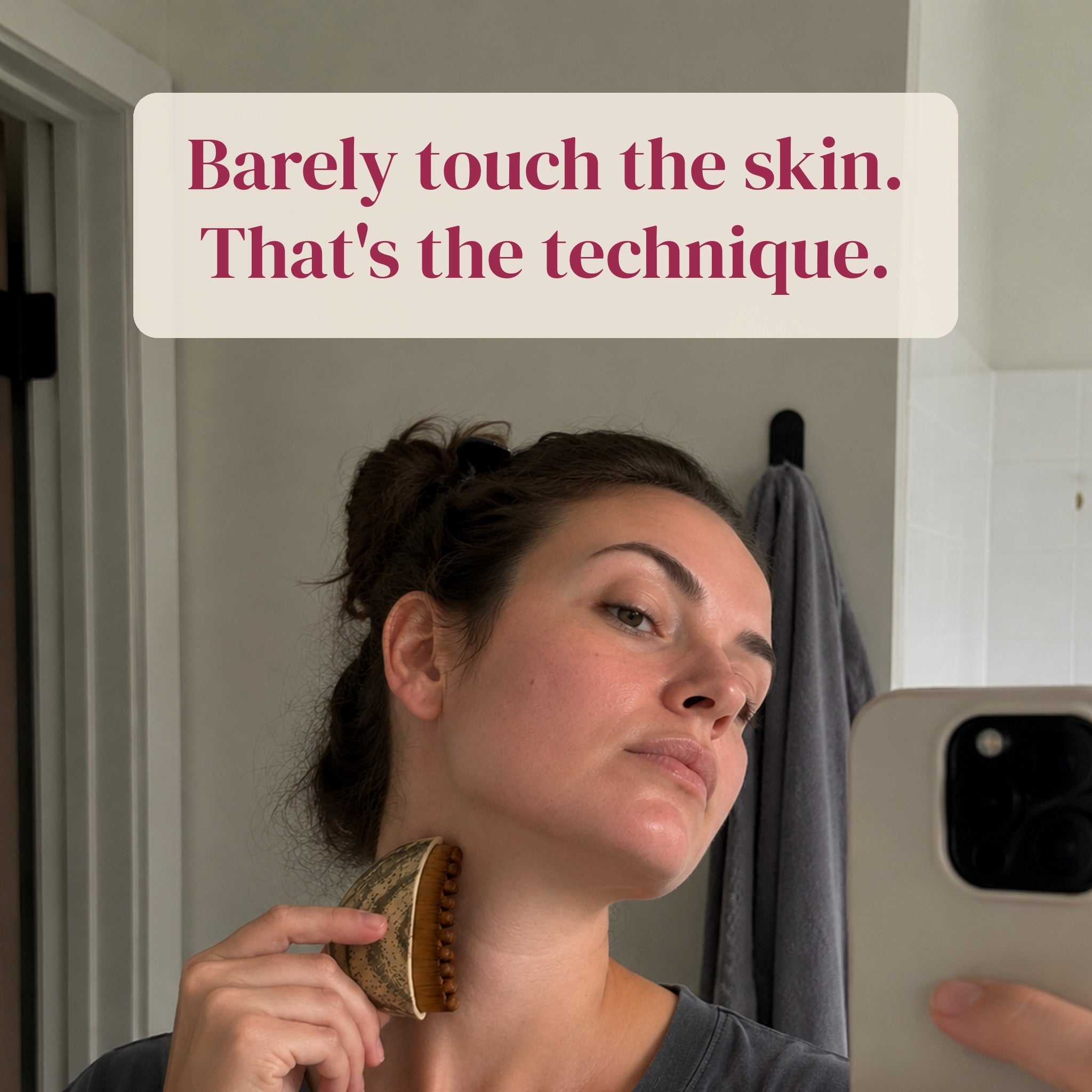 The brush resting lightly against the jaw, captioned: Barely touch the skin. That's the technique.